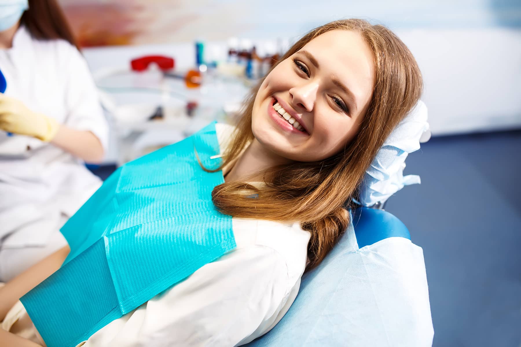 Woman smiling at a dental implant appointment in Apex, NC