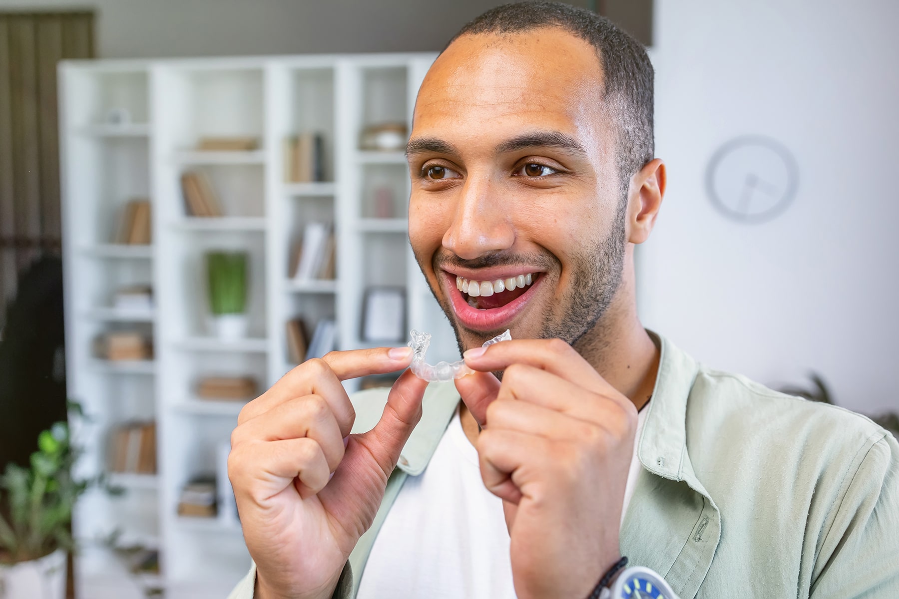 Man smiling with clear dental aligners in Apex, NC