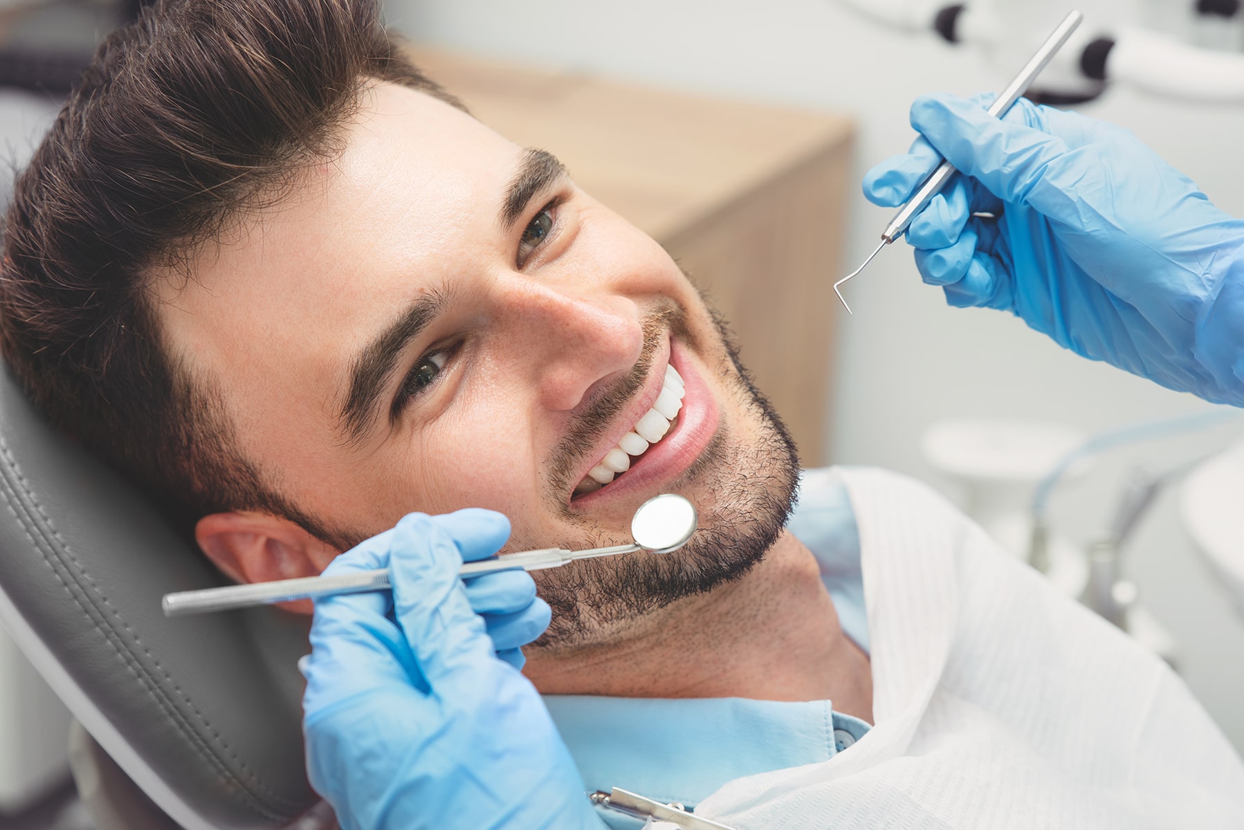 Man getting his teeth cleaned in Apex, NC