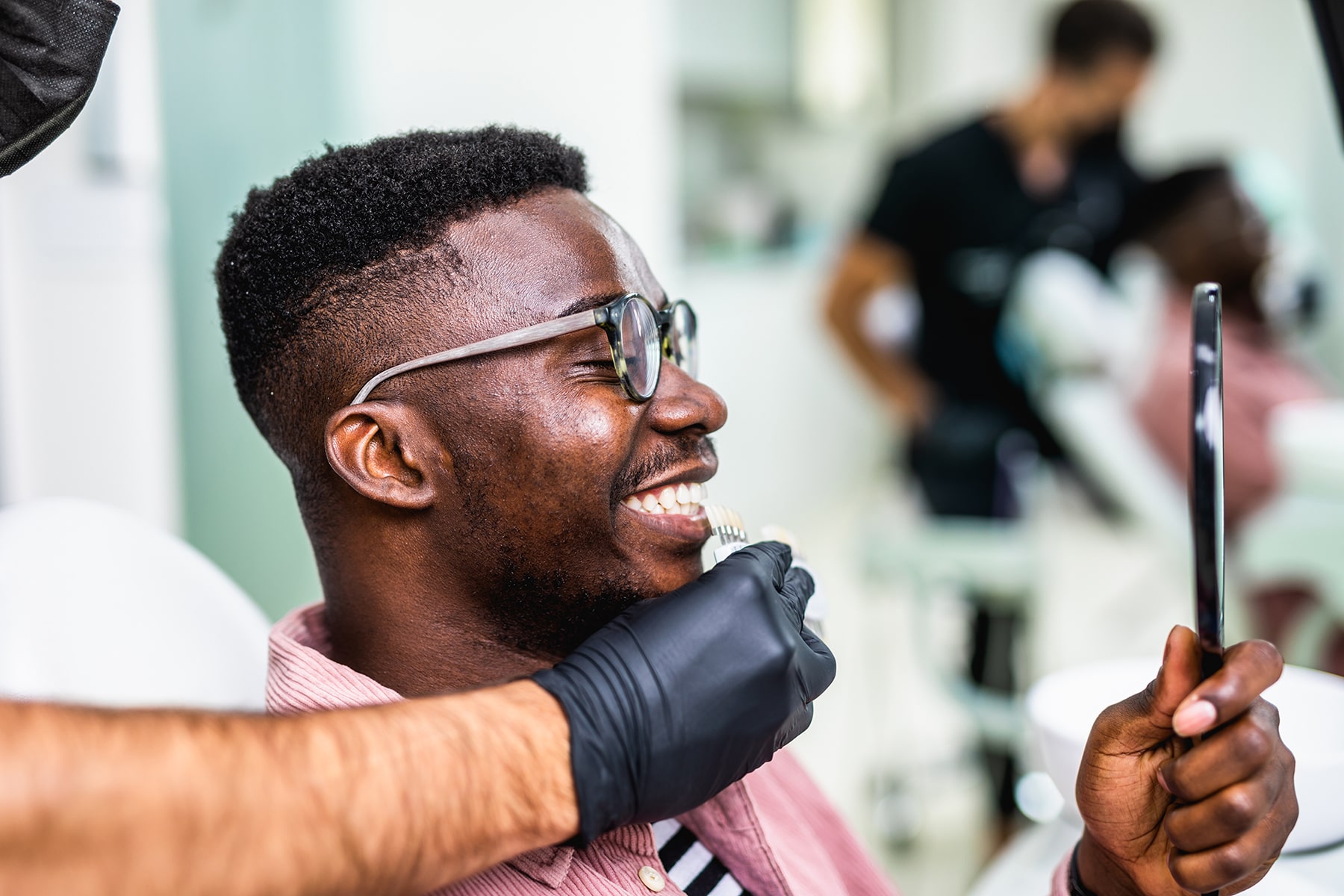 Man smiling after teeh bleaching treatment in Apex, NC