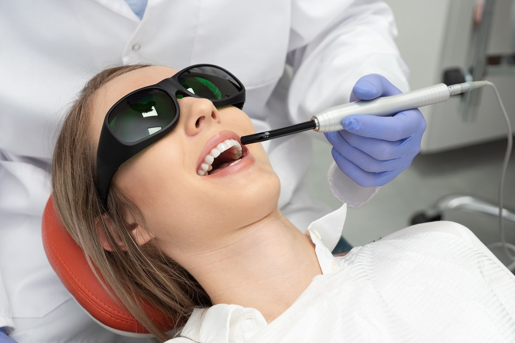 Woman getting a tooth filling in Apex, NC